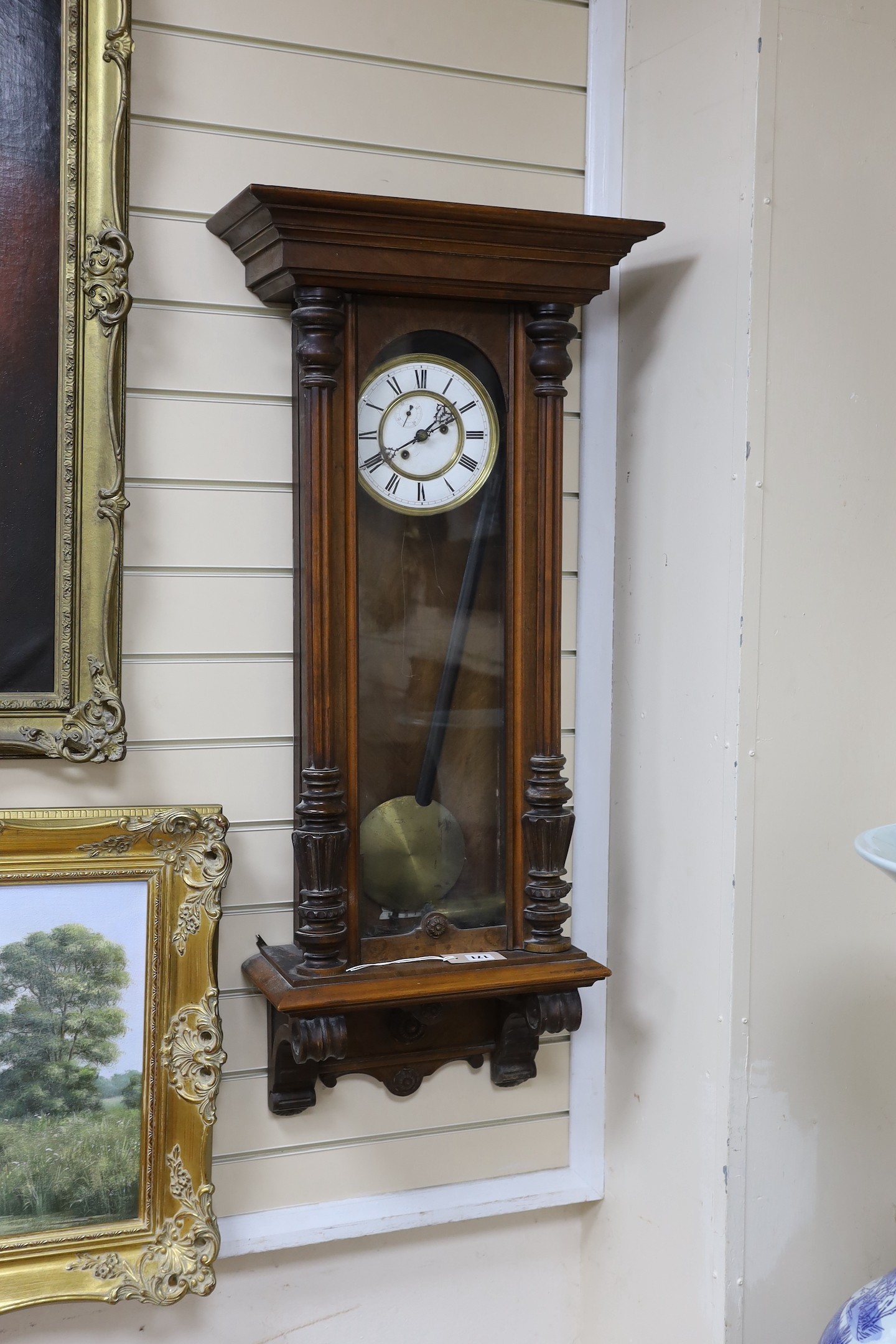 An early 20th century Vienna type wall clock